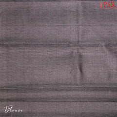 Matching Black blouse with elegant silver zari stripes for a sophisticated finish