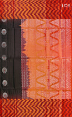 Embrace sophistication with PSR Silks' enchanting Black Soft Silk Saree, perfectly paired with a vibrant Lava Orange combination. This elegant saree is adorned with intricate silver and copper zari floral motifs, radiating timeless beauty.