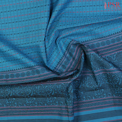 PSR Silks presents a traditionsal handloom Kalakshetra Kovai Cotton saree in a captivating Cerulean Blue, beautifully weaved pink & black thread work.