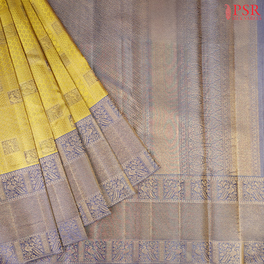 his Citrus Yellow & Dark Steel Blue Kanchipuram Silk Saree from PSR Silk Sarees is a radiant addition to the "Vaichitrya Kanjivaram" collection