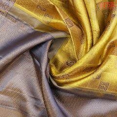 his Citrus Yellow & Dark Steel Blue Kanchipuram Silk Saree from PSR Silk Sarees is a radiant addition to the "Vaichitrya Kanjivaram" collection