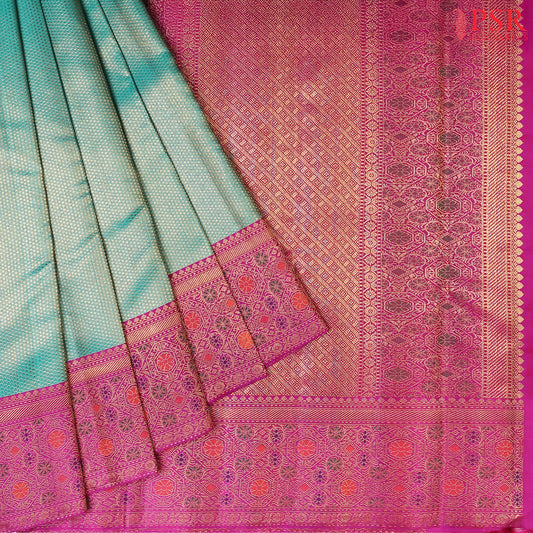Dark Cyan Bridal Kanchipuram Silk Saree with golden dots pattern and contrasting Vadamalli Purple border