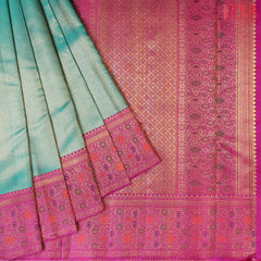 Dark Cyan Bridal Kanchipuram Silk Saree with golden dots pattern and contrasting Vadamalli Purple border