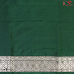PSR Silk Sarees presents an elegant Dark Green Banaras Silk Saree, a masterpiece of heritage and craftsmanship.