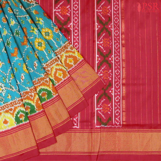 This Dark Turquoise & Red Pochampally Silk Saree from PSR Silk Sarees is a stunning embodiment of heritage and vibrance