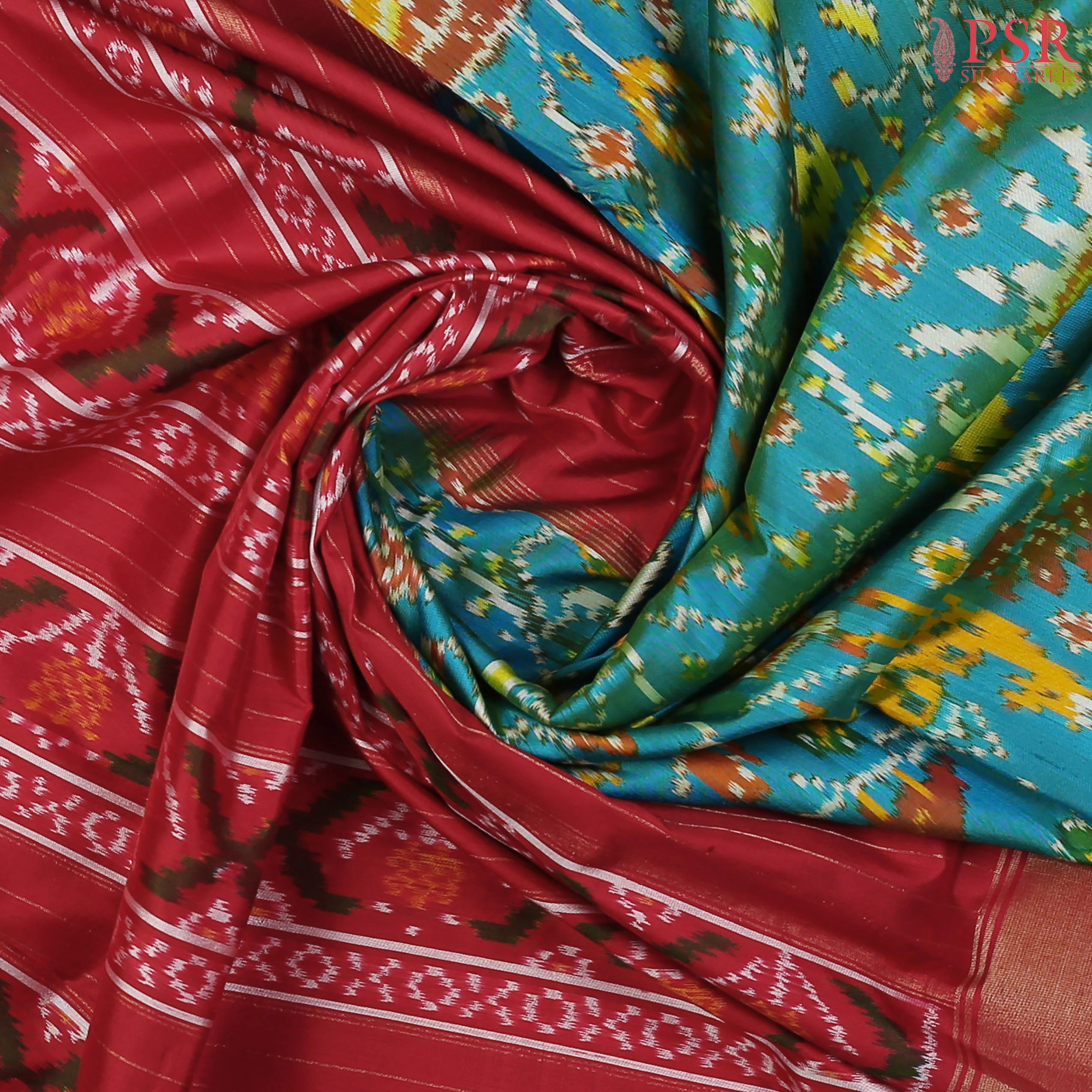 This Dark Turquoise & Red Pochampally Silk Saree from PSR Silk Sarees is a stunning embodiment of heritage and vibrance