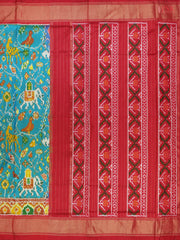 This Dark Turquoise & Red Pochampally Silk Saree from PSR Silk Sarees is a stunning embodiment of heritage and vibrance