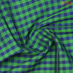 Green & Blue Cotton Silk Saree with checkered pattern, Burnt Orange pallu featuring stripes & Malli Moggu zari motifs, paired with a matching blouse.