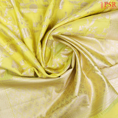 Brighten up your wardrobe with our Lemon Yellow Chiniya Silk Saree, beautifully contrasted with Dark Green accents.
