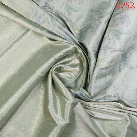 PSR Silk Sarees presents an exquisite & Light Mint Green Pashmina Tissue Silk Saree, a perfect blend of grace and tradition
