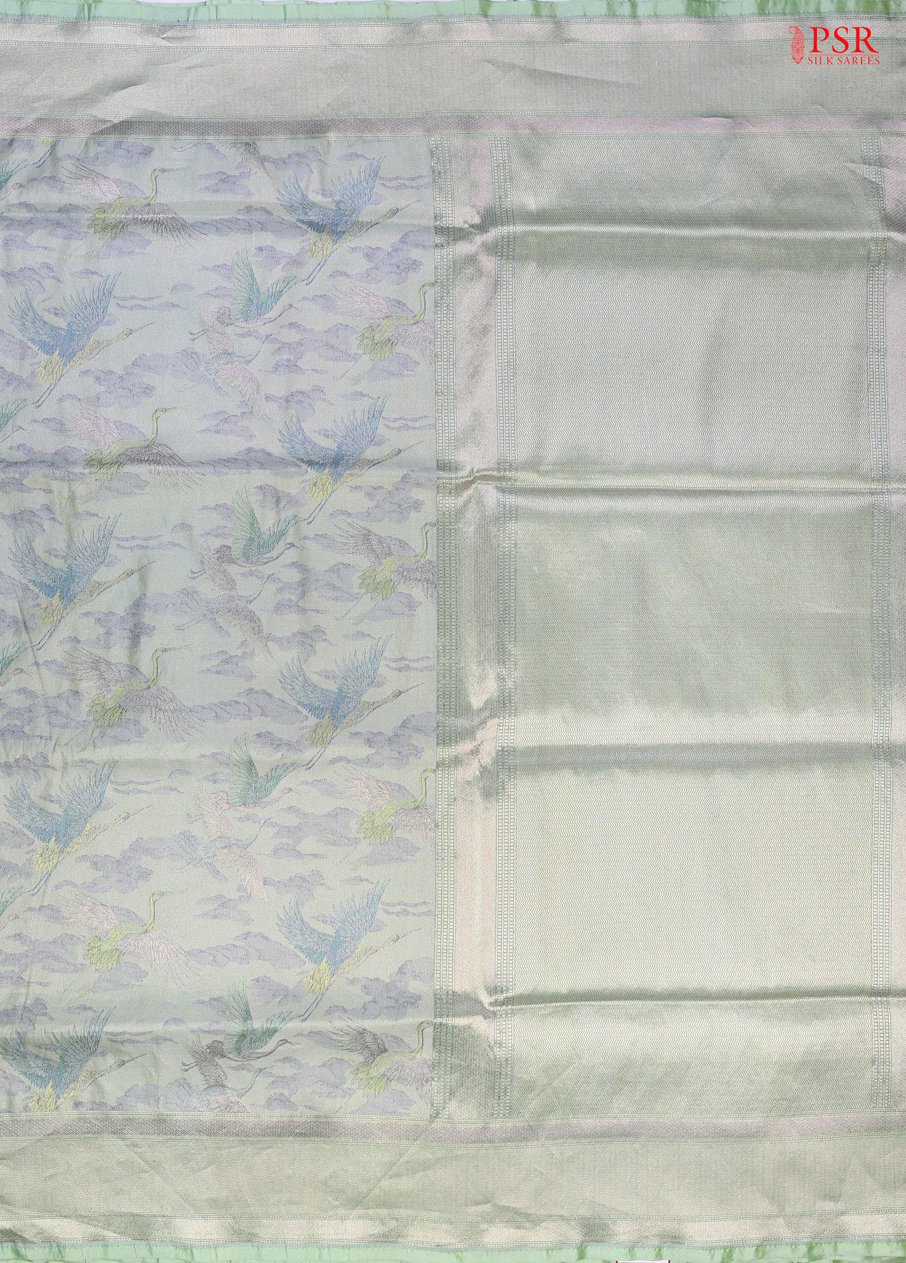 PSR Silk Sarees presents an exquisite & Light Mint Green Pashmina Tissue Silk Saree, a perfect blend of grace and tradition