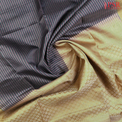 Introducing our stunning Mauve Purple Soft Silk Saree, beautifully paired with a soothing Light Olive hue. This graceful saree features small zari checks and a vibrant tri-color stripe pattern in Mauve Purple, Green, and Dark Blue, adding a unique touch of charm and style.