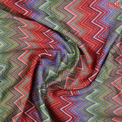 Intricate crushed texture and vibrant chevron weave on luxurious silk fabric