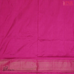 This Parrot Green & Magenta Pink Pochampally Silk Saree from PSR Silk Sarees is a stunning embodiment of heritage and vibrance.