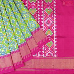 This Parrot Green & Magenta Pink Pochampally Silk Saree from PSR Silk Sarees is a stunning embodiment of heritage and vibrance.