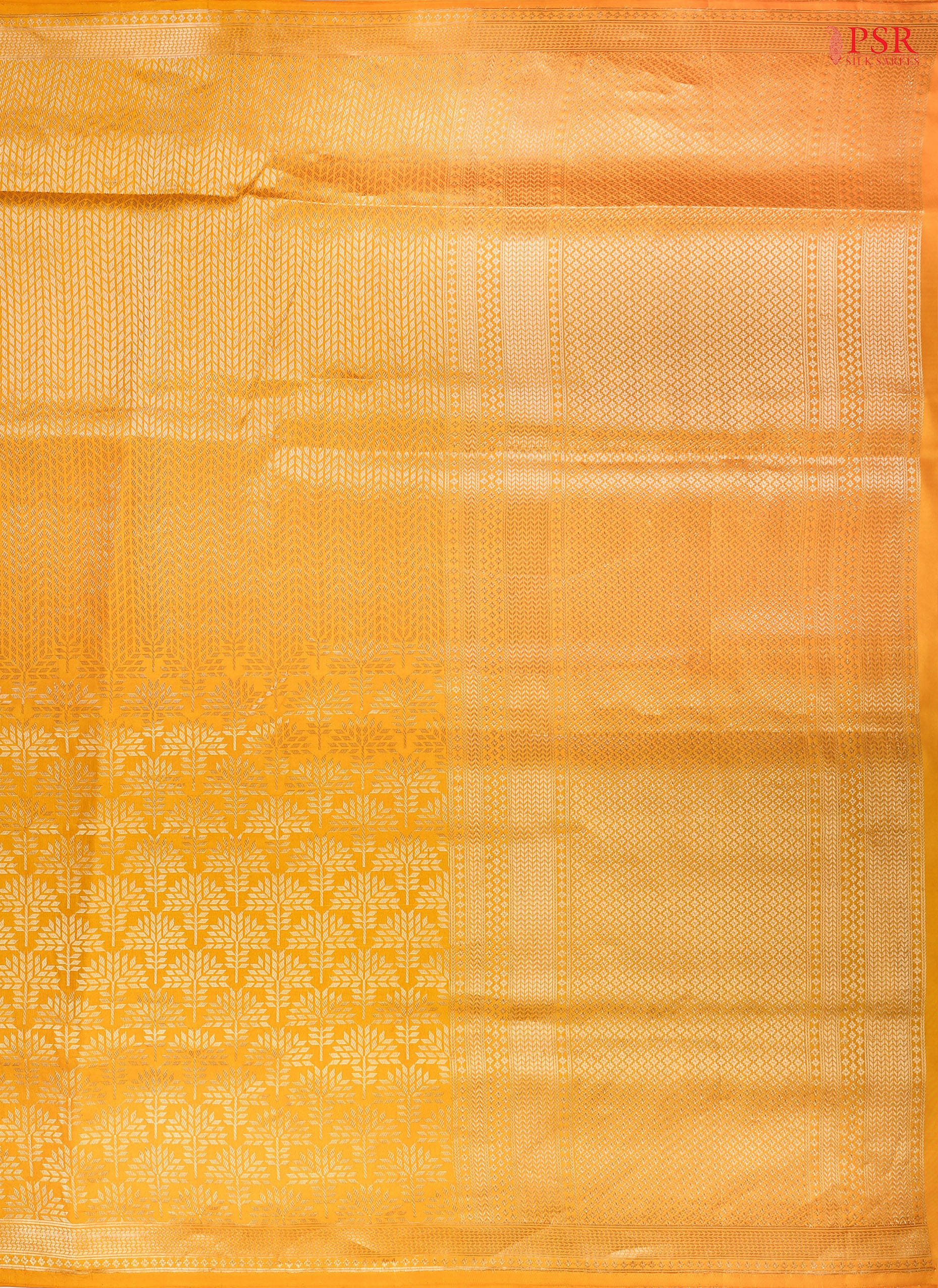 PSR Silk Sarees presents an elegant Amber Yellow Banaras Silk Saree, a masterpiece of heritage and craftsmanship.