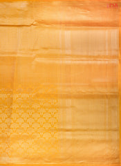 PSR Silk Sarees presents an elegant Amber Yellow Banaras Silk Saree, a masterpiece of heritage and craftsmanship.