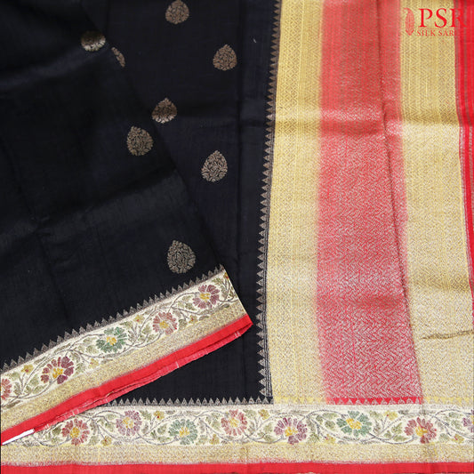 PSR Silks&nbsp;presents a voguish Black colored Banaras Jute Silk saree with combination of Red color