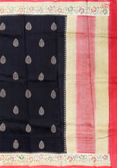 PSR Silks&nbsp;presents a voguish Black colored Banaras Jute Silk saree with combination of Red color