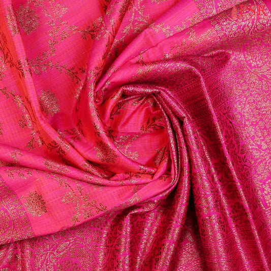 PSR Silks presents a stunning Barbie Pink Banarasi Silk Saree, beautifully contrasted with rich Magenta Pink accents.