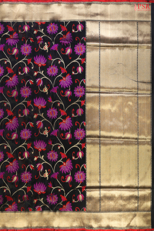PSR Silks presents a breathtaking Black Banarasi Silk saree, a true embodiment of grace and sophistication.