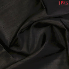 Black Jute Soft Silk Saree with golden zari work, rich Red pallu, and matching designer blouse with zari detailing