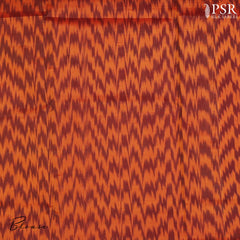 Embrace sophistication with PSR Silks' enchanting Black Soft Silk Saree, perfectly paired with a vibrant Lava Orange combination. This elegant saree is adorned with intricate silver and copper zari floral motifs, radiating timeless beauty.