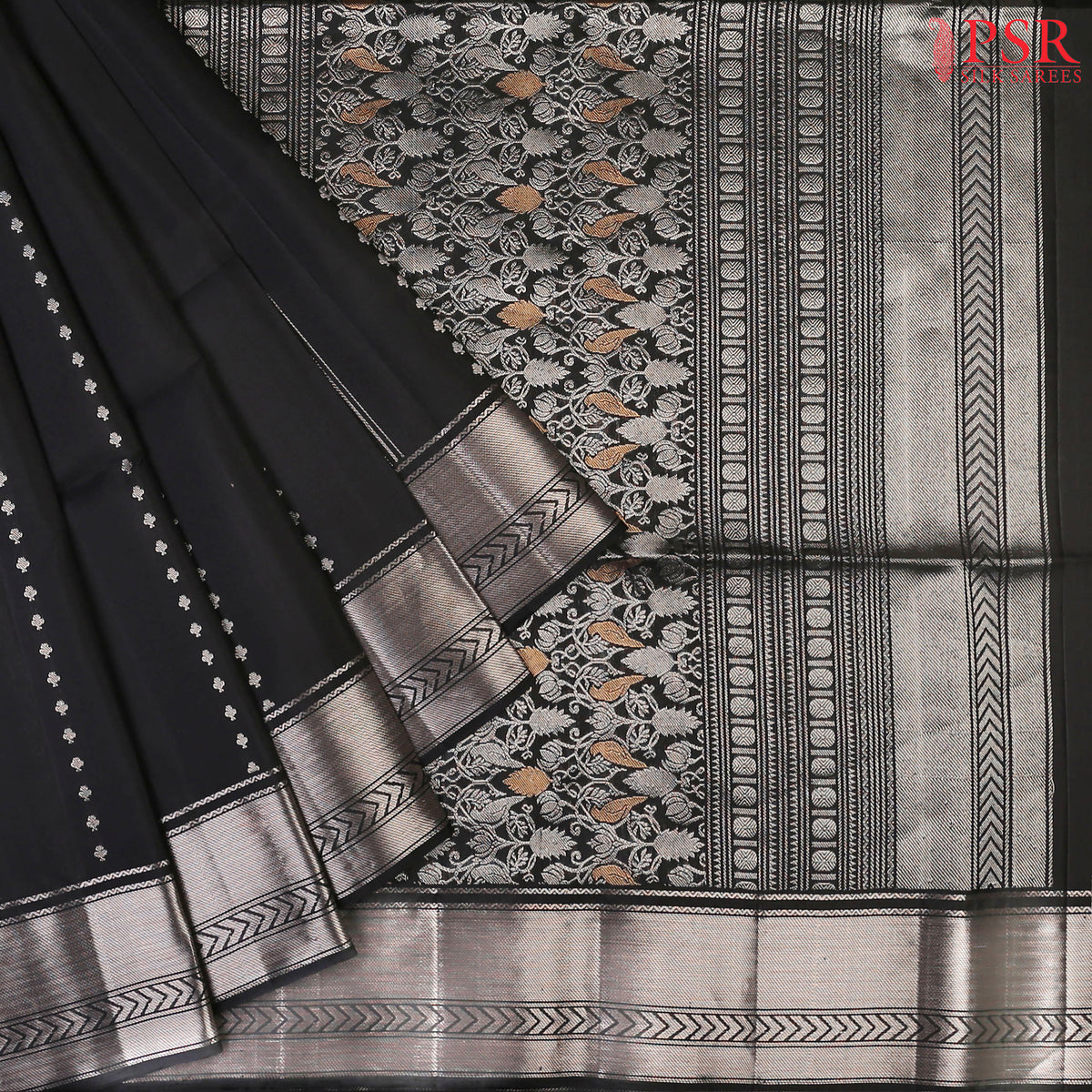 Embrace the charm of classic beauty with our Black Soft Silk Saree, a masterpiece designed to make a statement at every occasion.