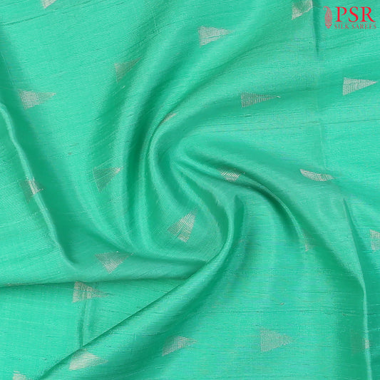 Caribbean Green Jute Soft Silk Saree with silver zari triangle motifs, rich Magenta Pink pallu, and matching plain blouse.