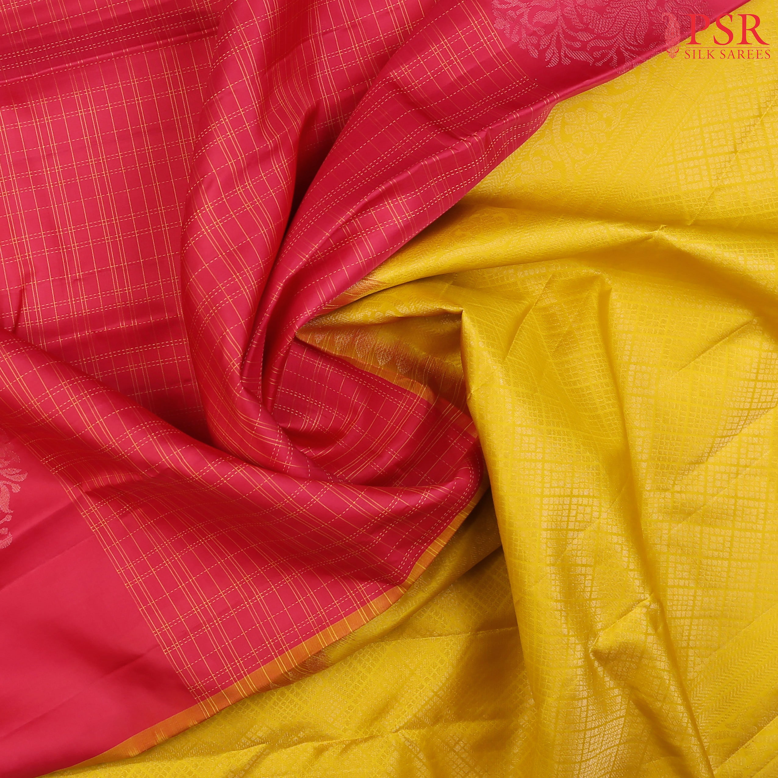 PSR Silk Sarees presents an exquisite Cerise Pink&nbsp;Soft Silk Saree, beautifully paired with a&nbsp;contrasting Amber Yellow&nbsp;hue. 