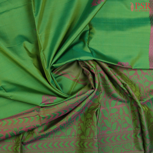 PSR Silk Sarees introduces the vibrant and enchanting Chateau Green Soft Silk Saree, a perfect blend of elegance and charm. This stunning saree is adorned with&nbsp;magenta pink thread floral motifs, creating a delicate yet striking contrast.