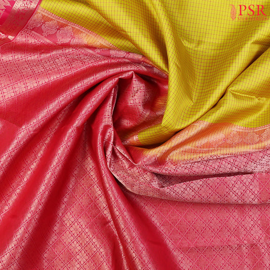 PSR Silks presents a Corn Yellow Fancy Kanchipuram Silk Saree, elegantly paired with a striking Magenta Pink combination. A timeless blend of tradition and grace