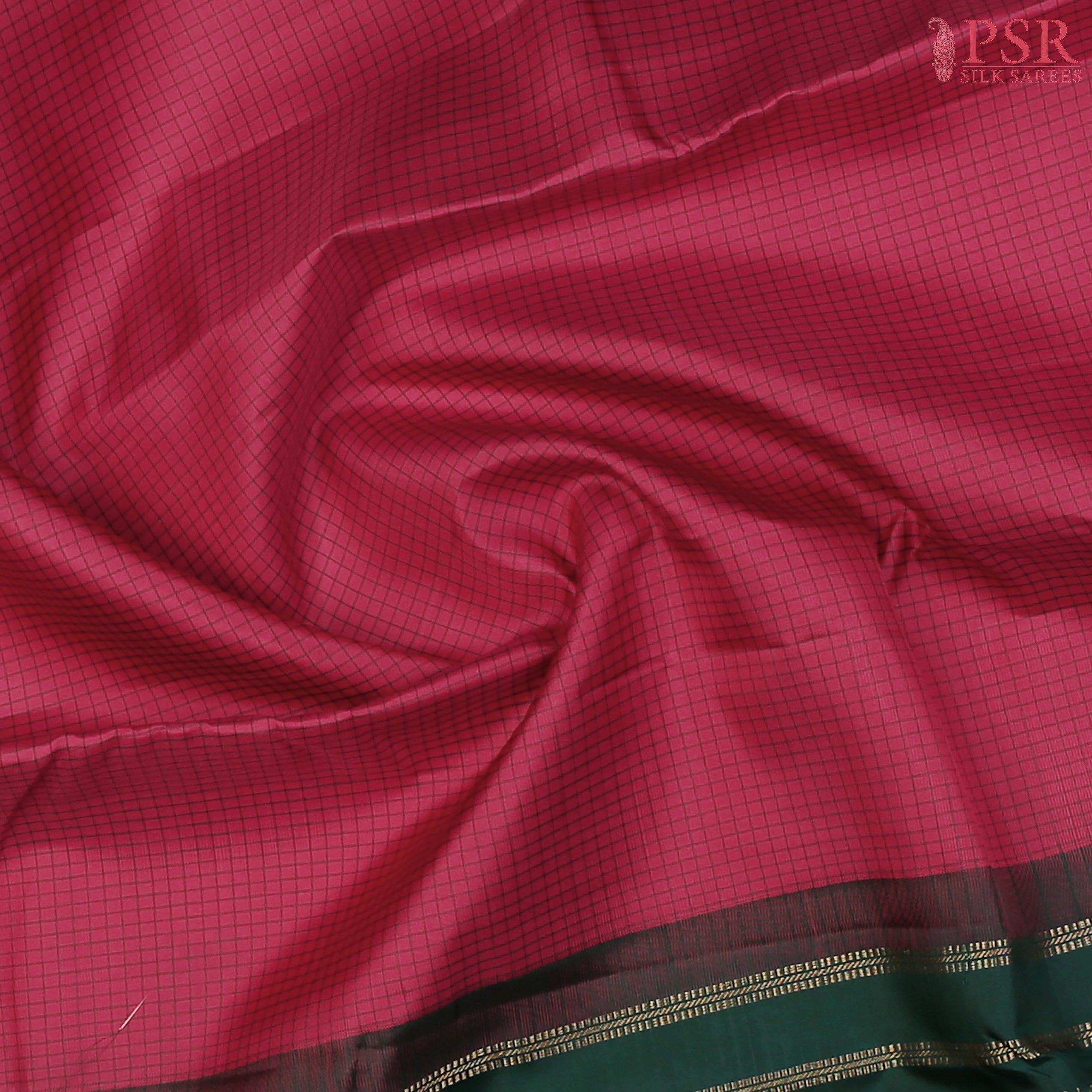 PSR Silks presents a Dark Cerise Pink Fancy Kanchipuram Silk Saree, elegantly paired with a striking Dark Green combination. A timeless blend of tradition and grace!