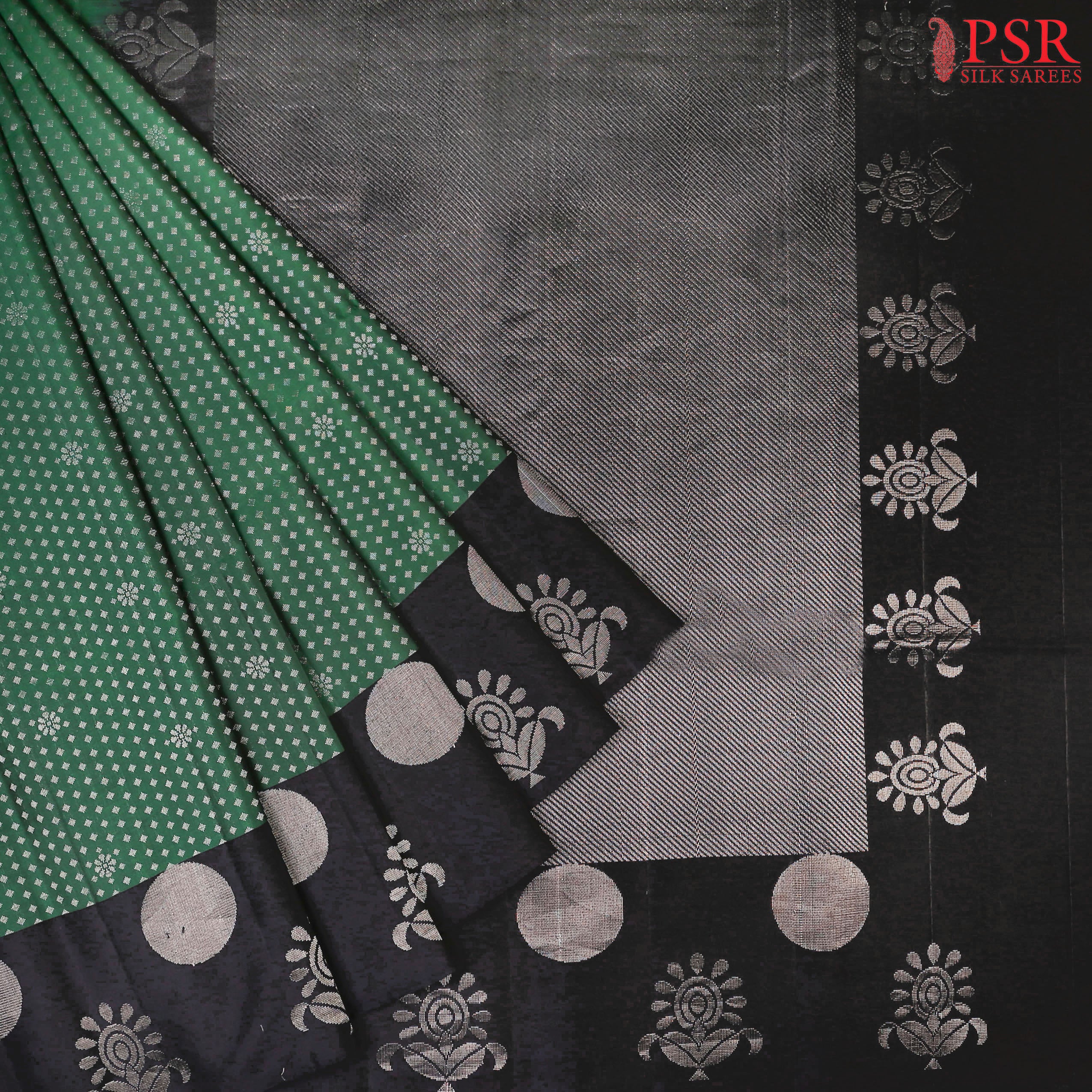 Step into a world of refined beauty with our Dark Green Soft Silk Saree, elegantly paired with a classic Black combination. 
