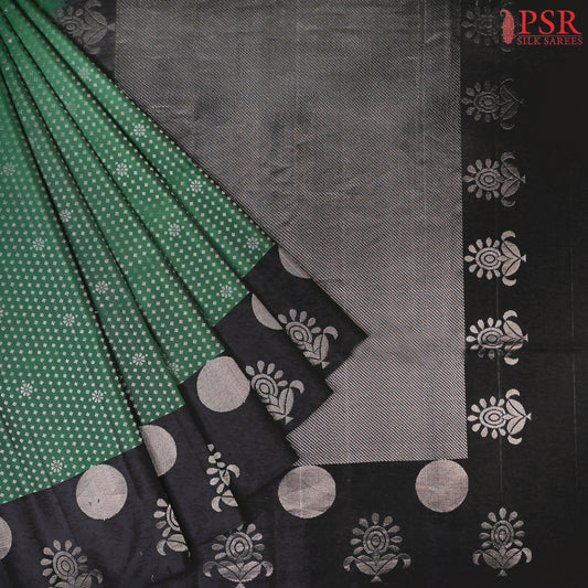 Step into a world of refined beauty with our Dark Green Soft Silk Saree, elegantly paired with a classic Black combination. 
