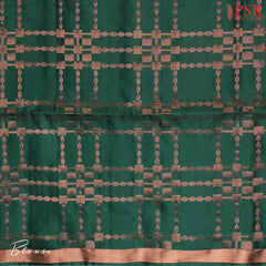 Indulge in timeless elegance with our Dark Green&nbsp;Soft Silk Saree, crafted to perfection with&nbsp;impressive copper zari jacquard stripes patterm.