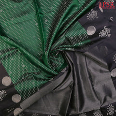 Step into a world of refined beauty with our Dark Green Soft Silk Saree, elegantly paired with a classic Black combination. 