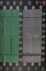 Step into a world of refined beauty with our Dark Green Soft Silk Saree, elegantly paired with a classic Black combination. 