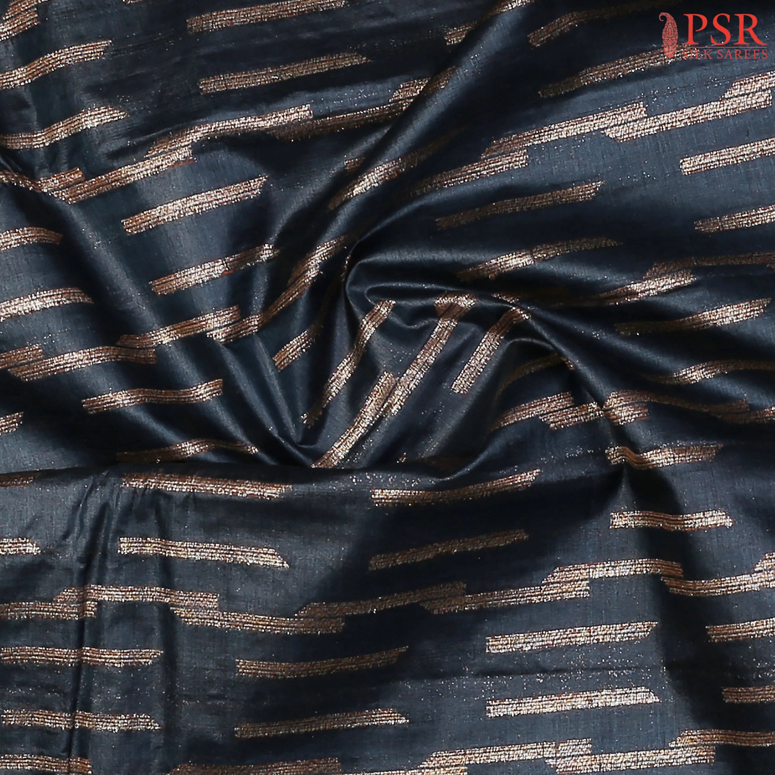 Delicate mixed zari weaving on lightweight tussar silk fabric.