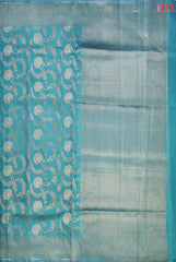 PSR Silks introduces a stunning Dark Turquoise Banarasi Jute Silk saree, perfect for making a statement.