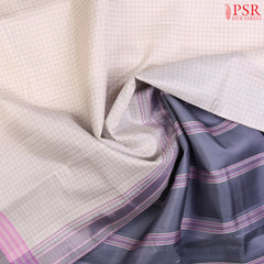 PSR Silks presents a Dove White colored Arani Silk saree with combination of Dark Grey color.