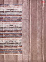 Presenting a Soft Chiniya Silk Saree in a graceful Dusty Mauve hue, designed to captivate and charm. This exquisite saree features brush stripes complemented by intricate zari brocade motifs, adding a modern twist to traditional beauty.
