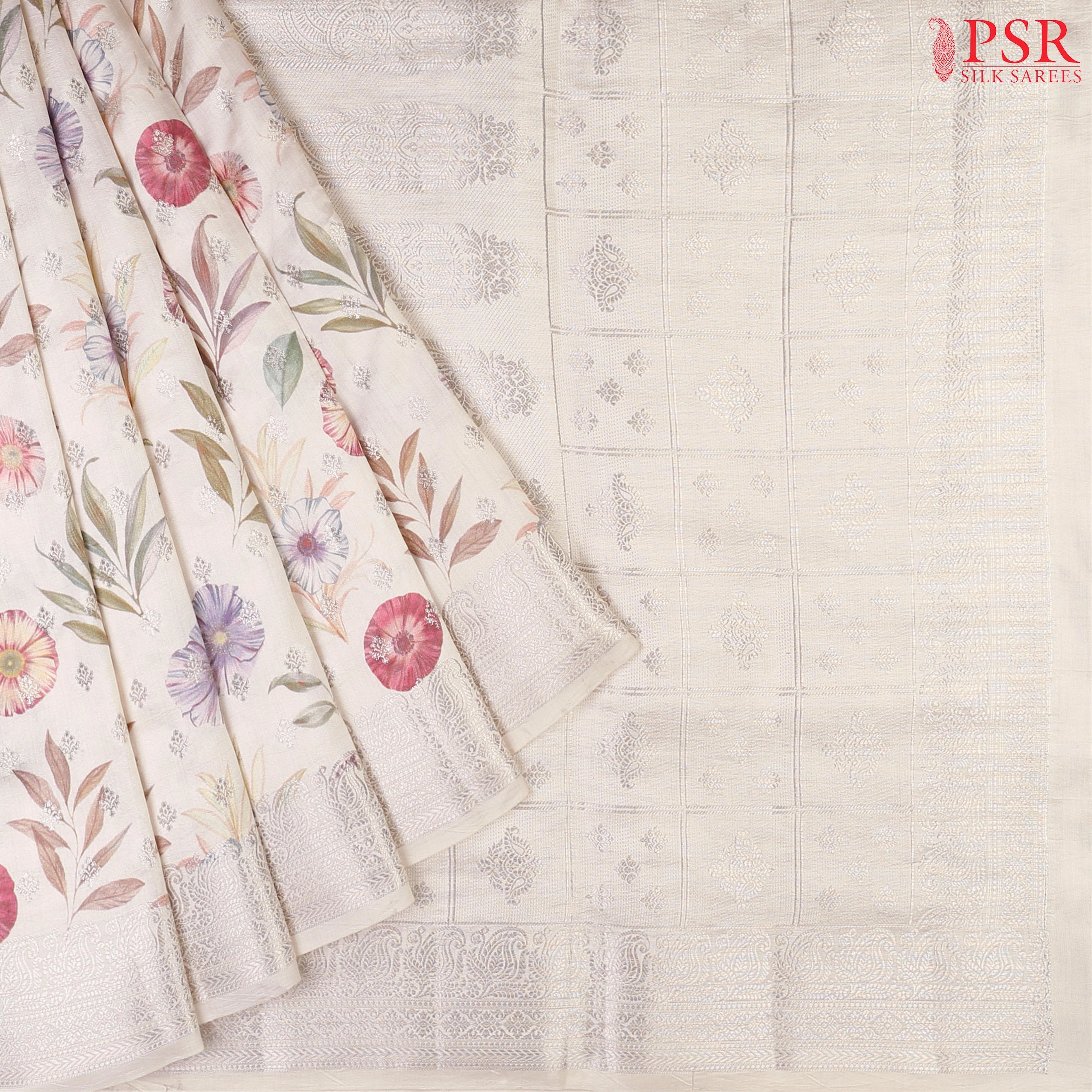 Floral White Chiniya Silk Saree with colorful floral prints and silver zari brocade motifs.