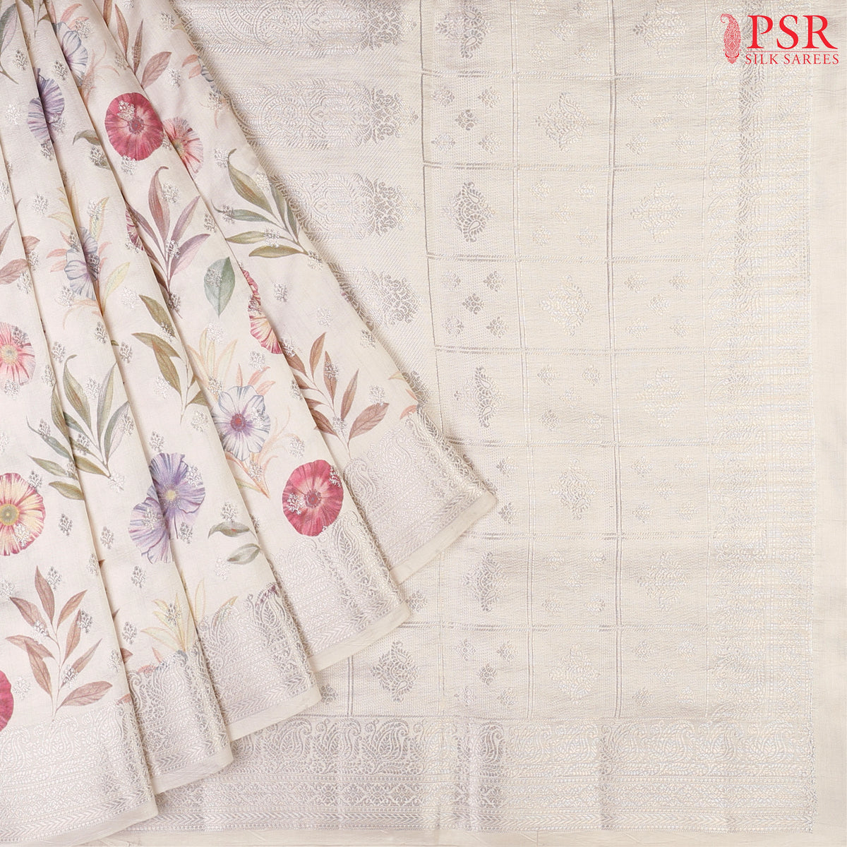 Floral White Chiniya Silk Saree with colorful floral prints and silver zari brocade motifs.