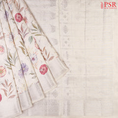 Floral White Chiniya Silk Saree with colorful floral prints and silver zari brocade motifs.