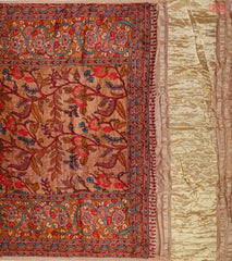 Golden tissue pallu featuring vibrant Kalamkari artwork.