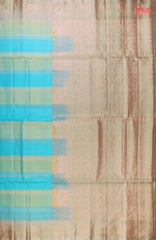 PSR Silk Sarees presents a graceful Light Blue and Light Green Soft Silk Saree, beautifully paired with a sophisticated Olive Grey accent. This saree stands out with its&nbsp;double-colored stripes, delicately woven with lustrous copper zari work, adding a touch of modern elegance.