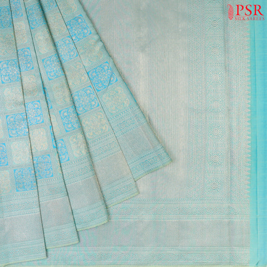 Light Turquoise Kanchipuram Silk Saree with checkered jacquard work, rich zari pallu, and blouse with Vazha Illai Stripes
