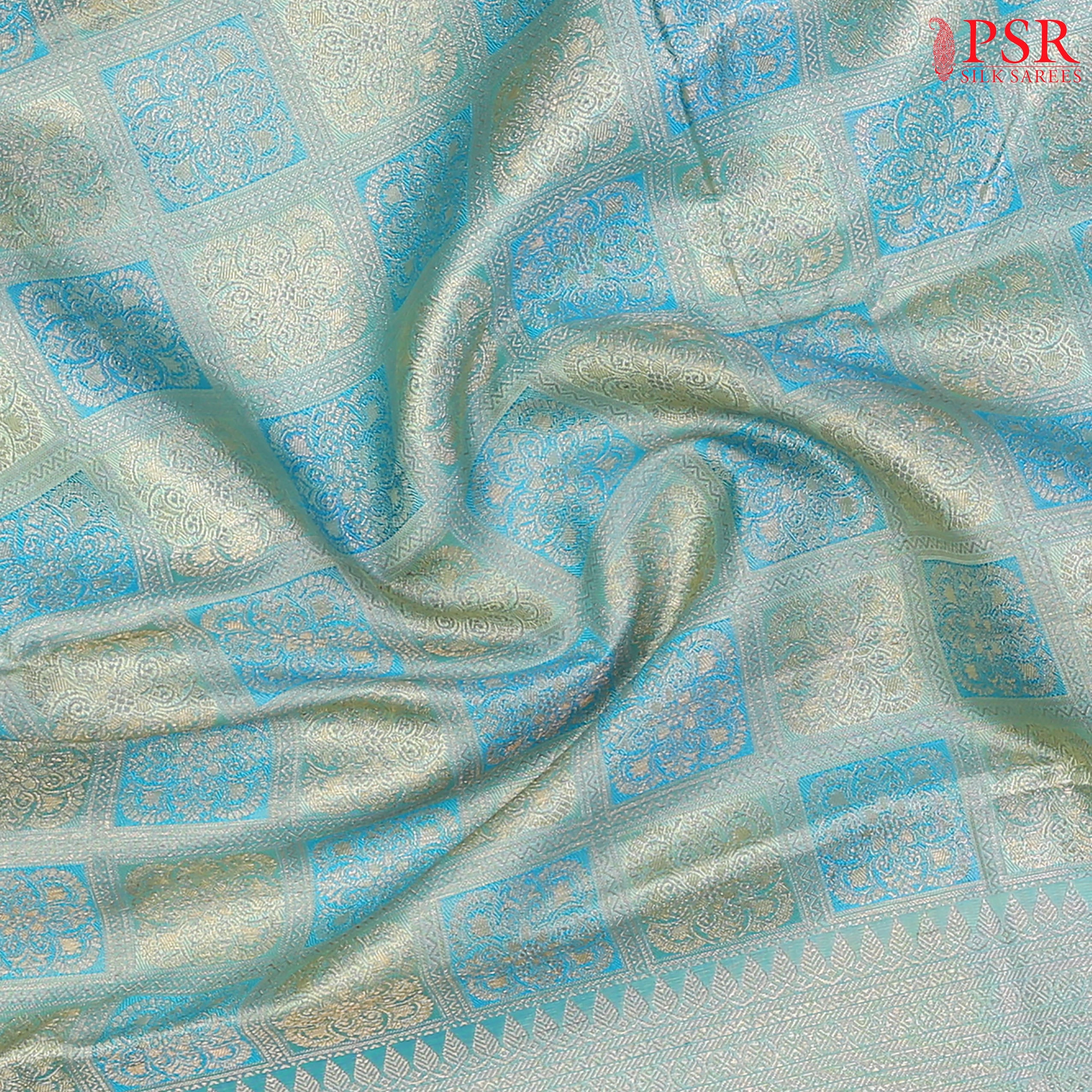 Light Turquoise Kanchipuram Silk Saree with checkered jacquard work, rich zari pallu, and blouse with Vazha Illai Stripes