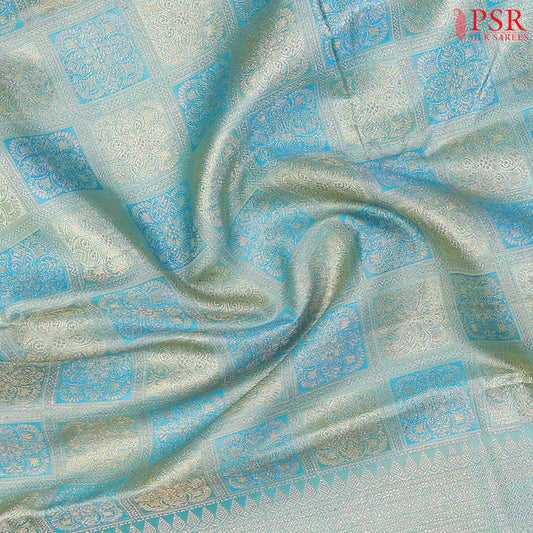 Light Turquoise Kanchipuram Silk Saree with checkered jacquard work, rich zari pallu, and blouse with Vazha Illai Stripes